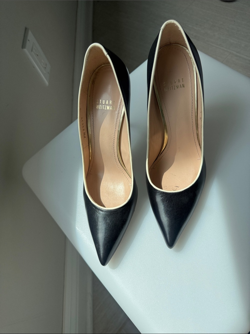 Stuart Weitzman Black Leather Pointed Pumps with Cream Trim